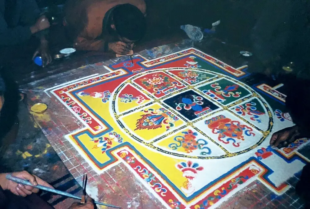 Making a sand mandala with monks in tibet