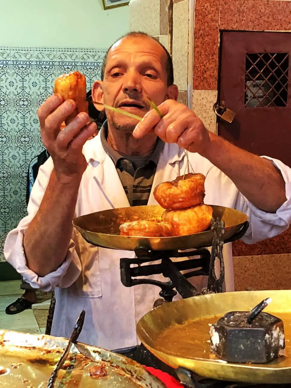 Food tour Marrakech donuts on palm leaf string