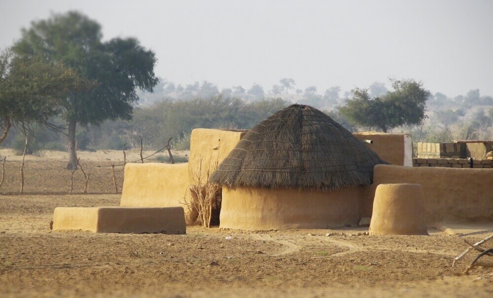 mud hut village on camel safari near jaisalmer