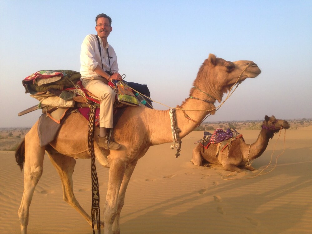 arriving at dunes near jaisalmer on camel
