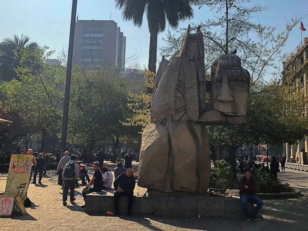 Santiago food tour plaza de armas indiginous statue