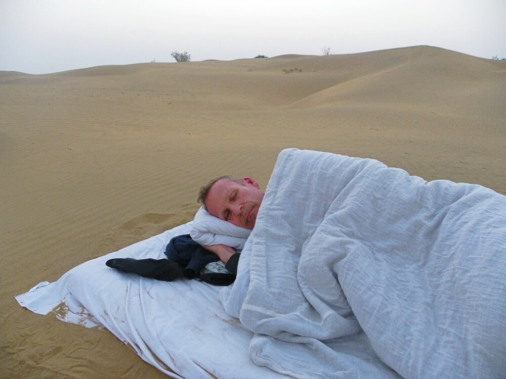 camel safari sleeping on the dunes