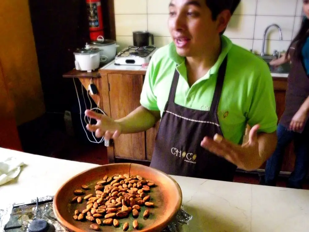 Roasting cocoa beans at chocolate workshop antigua guatemala
