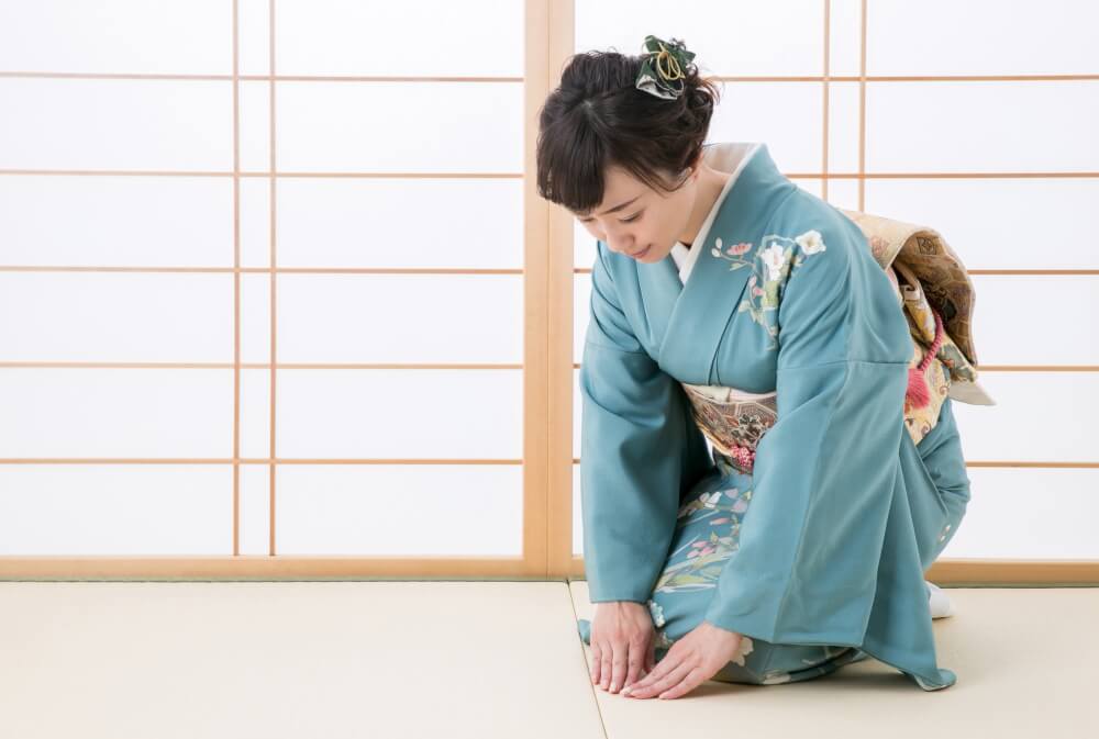 Ryokan hostess in kimono bowing