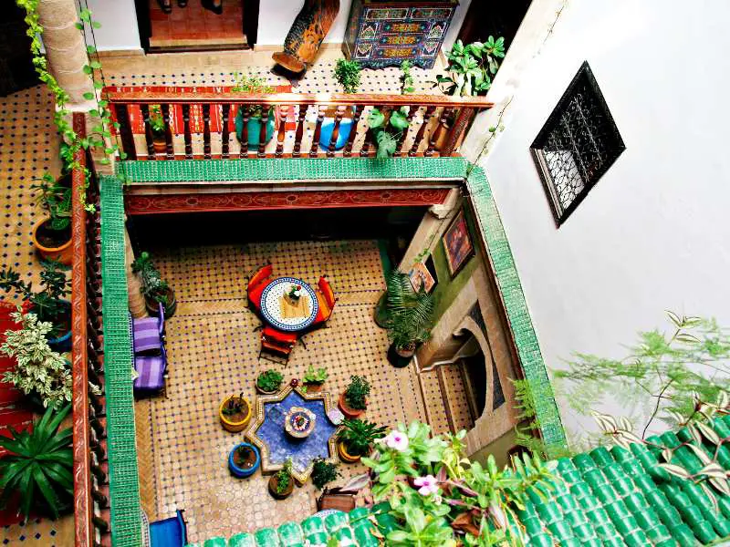 looking down at a courtyard in a riad in Marrakech