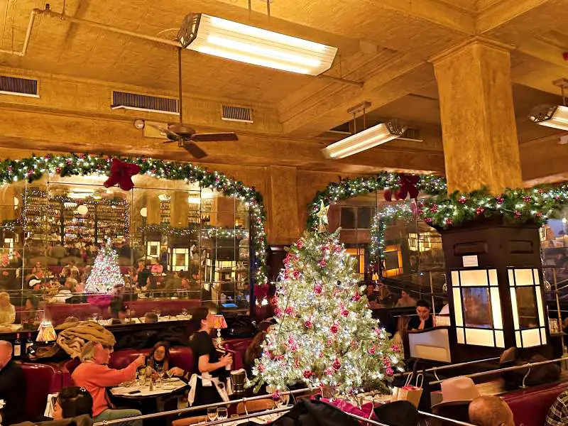 busy restaurant with a christmas tree